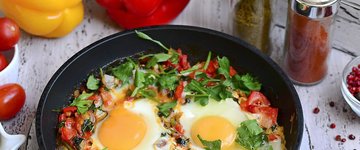 Baked Eggs Skillet With Red Peppers and Onions