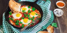 Baked Eggs Skillet With Red Peppers and Onions