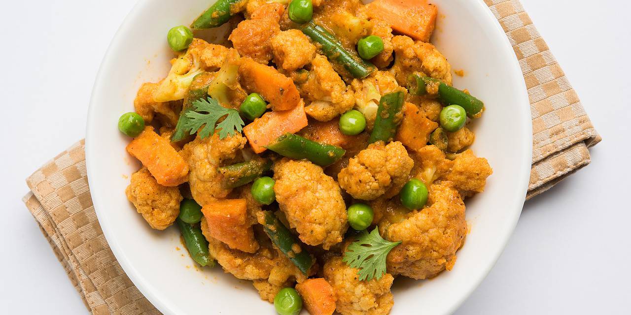 Cauliflower Chickpea Curry with Quinoa and Peas